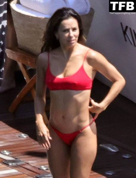 Eva Longoria Showcases Her Stunning Figure and Ass Crack in a Red Bikini on Holiday in Capri on www.modeladdicts.com