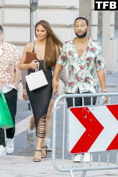 Chrissy Teigen Goes Braless Under a Very Sexy Sheer Black Dress in France - France on modeladdicts.com